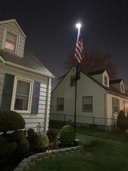 White solar flagpole light from Atlantic Flagpole, designed for premium illumination of flagpoles.