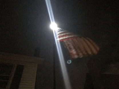 Premium bright solar flagpole lighting system in white by Atlantic Flagpole, designed for efficient flag display.