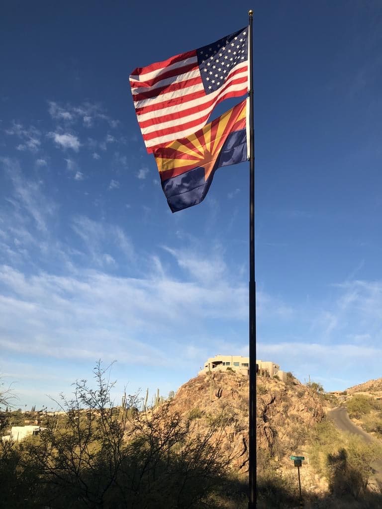 Large nylon American flag in vibrant red, white, and blue, by Atlantic Flag & Pole Inc., available in multiple sizes.