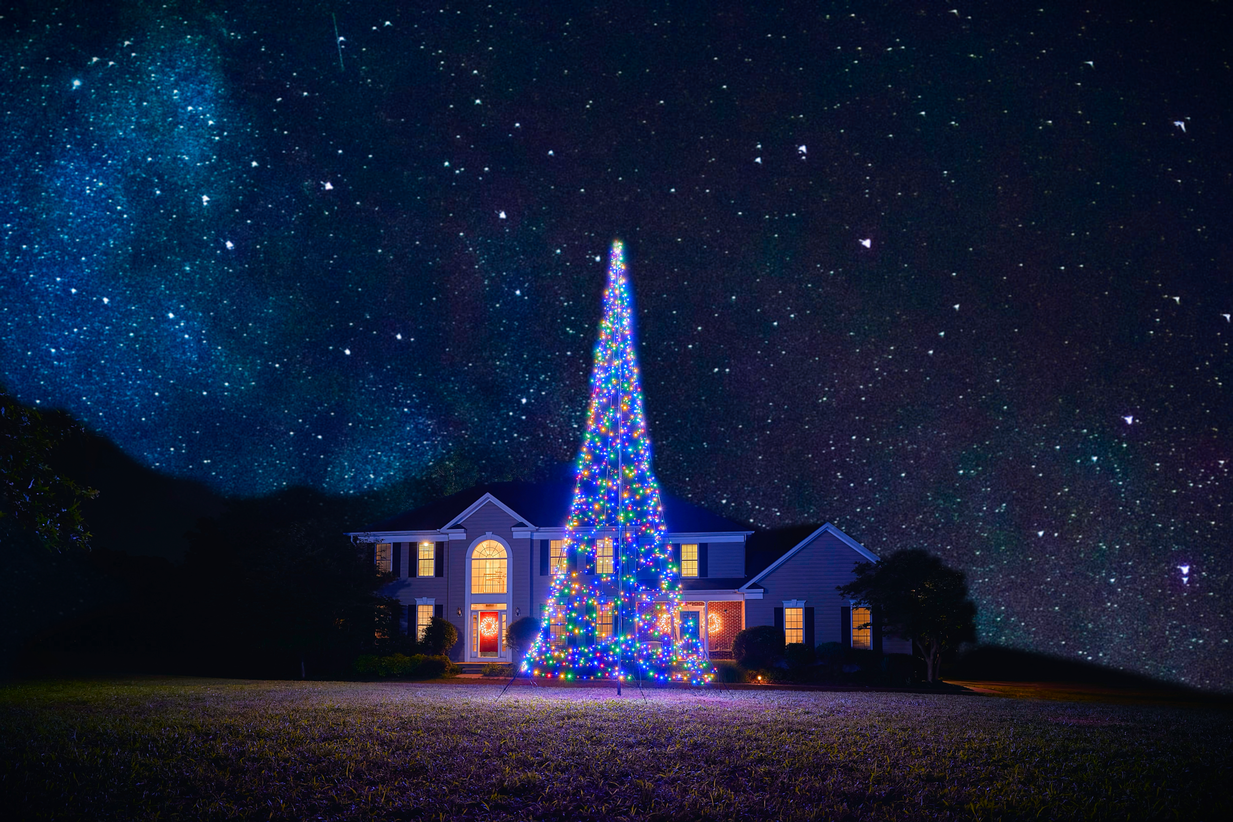 Warm white LED Christmas tree on a 20' flagpole, featuring 900 lights, from Atlantic Flagpole