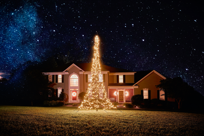 LED Christmas tree for flagpole by Atlantic Flagpole, illuminated with warm white lights, set against a night sky.